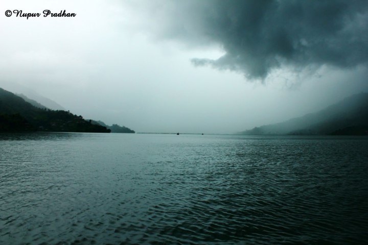 Dark clouds approaching the vast Phewa Lake